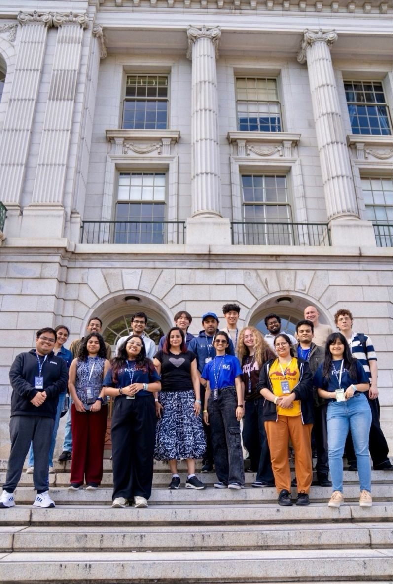 Hackathon participants on the steps of a Berkeley building