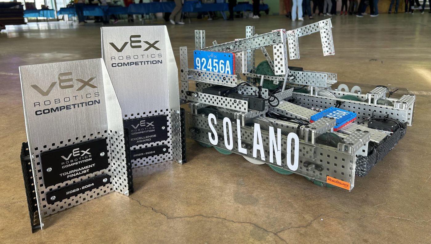 Robot 92456A beside VEX trophies